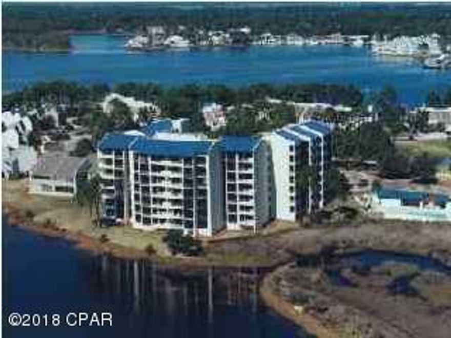 Watch the marsh birds wading, the fish jumping and the boats gliding along in the Grand Lagoon! This Lagoon Towers unit has been updated with tile floors, stainless appliances, modern fixtures and solid surface counter tops. It has a beautiful view of the tidal marsh, the Grand Lagoon and pool. Beautiful and move in ready!