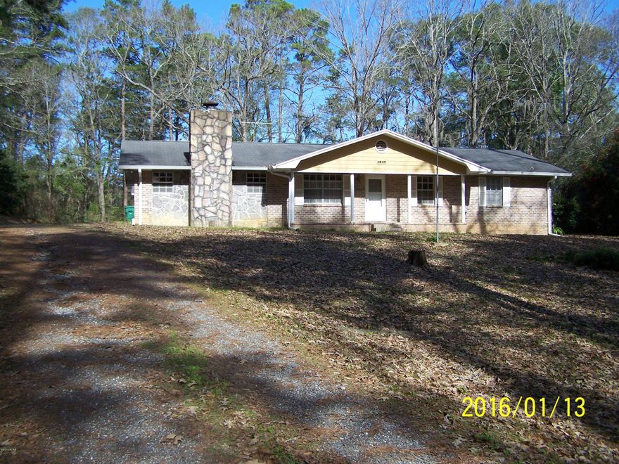 Large and attractive 3BR, 2 1/2b ,brick home, just north of Marianna, FL in a very nice residential area.  Home is located on a beautifully treed, sloping lot, and includes a detached two car garage, and a very well equipped workshop with work benches, dust collection system. Home needs some updating, but is in excellent condition with a newer AC system.
