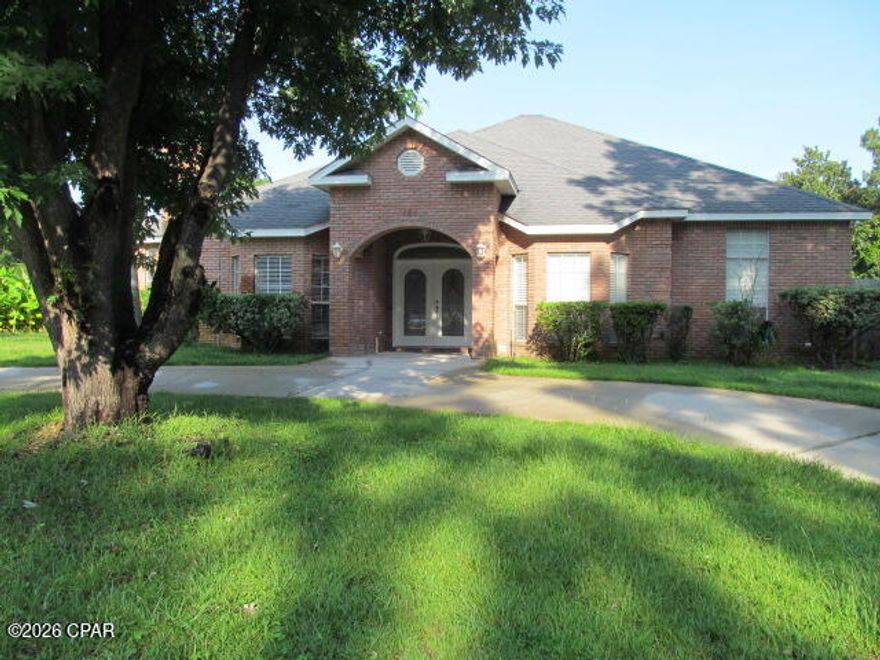 Grand Lagoon Shores - Located on a large corner lot this brick, 3 bedroom, 2.5 bath home with over 2700 sq. ft. features formal dining area, bonus room with wood burning fireplace, open kitchen with island and breakfast area. Double French doors lead from the living area to the open back patio. Large master bedroom has French doors leading to patio area and features a master bath with garden tub, separate shower, double vanity and water closet. Home hosts a large fenced back yard and two separate diveways. 2 car garage with separate entrance for golf cart. Sprinker system is on well. 1 small dog or cat under 20 lbs. $250 pet deposit/$50 pet fee/$25 month pet rent.  Oven light is non-operational.