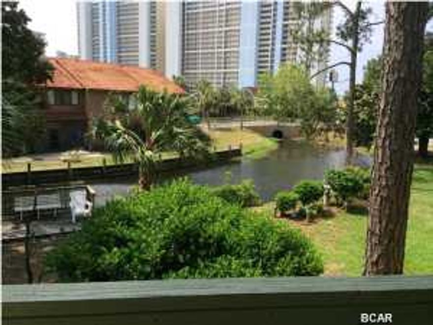 Beautiful Canal Front 2 Bedroom and 2 1/2 Bathroom townhouse located in Gulf Highlands Beach Resort - one of the most popular family oriented resorts in Panama City Beach. No waiting for an elevator or looking for parking spot in an enormous parking garage here! This particular unit is one of the closest one to the dedicated beach access and not one but 2 assigned parking spaces right outside of the front entrance of the unit! Gulf Highlands Beach Resort is a gated community, offers many amenities including a Beachside Pool & Clubhouse, 11 other pools (5 Heated), 4 tennis courts (2 Lighted), 18 Hole Mini Golf, shuffle boards, dedicated beach access with beachside pool and clubhouse . Best of all is a LOW LOW Home Owner's Association fee of under $140 per month that takes care of all