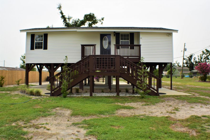 CURRENTLY UNDER CONTRACT, SELLER ACCEPTING BACKUP OFFERS.  One owner, custom built home on a half-acre lot!  This 3BR/2BA home has a 1.5 year old roof, the AC/heat pump is only 2 years old, new carpet in two bedrooms, vinyl plank flooring throughout the rest of the home, and the home is immaculate!  There's covered parking under the home with room for three cars and the 40x20 pole barn with power and also water access, is ideal for parking a boat or RV or use a party pavilion!  The entire lot is fenced and the home is nestled on a dead end street so its quiet and no traffic! Excellent home for first-time home buyers or empty nesters looking to downsize.  You're convenient to shopping,  medical facilities, schools and more!  All info is approx and must be verified by Buyers if important.