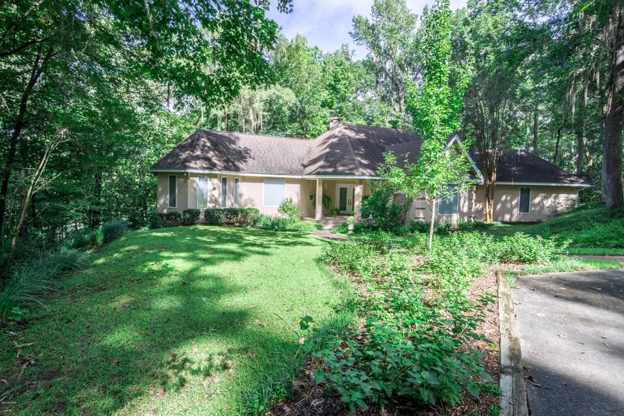 Beautiful water front, custom built, single level, 3 bedroom, 2 & 1/2 bath executive home located on the spring fed Merritt's Mill Pond. Lovely wooded approx. 3 acre lot with breathtaking views from a screen porch as well a wrap-around porch that faces the lake.  Updated bathrooms and kitchen that project a recently built home (1992) with the finest decor and quality.  Landscaped grounds to enhance the beauty of the natural surroundings.