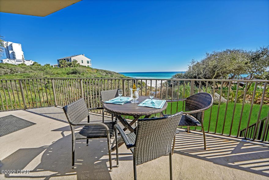 Come take a tour of this beautiful furnished condo, located in the heart of Seagrove in Legacy Condominiums! Beautifully remodeled, with the feel of seclusion and privacy are just a few short words to describe this exquisite luxury condominium. Enjoy the lush scenery of the dunes overlooking the beach. You'll feel like the sparkling emerald Gulf waters are right at your fingertips while in this unit. The view in person from this unit is truly special and is a MUST SEE in person.  This unit is located in a gated complex on the ground floor, making it private with easy access directly to the beach, as you will be able to walk directly down to the beach right from your own balcony. The open floorplan with crown molding, updated tile throughout, remodeled bathrooms, spacious bedrooms, 10'ceilings, wet bar and a large updated kitchen are sure to please. There is also a large balcony that extends the entire width of the unit with access from the living room and the master bedroom. As if there isn't enough to love about this condo... You will walk right from your vehicle to inside your unit, without ever having the hassle of dealing with elevators. Also, enjoy the private beachside pool or enjoy the almost 200' of sugar white sand beaches. Another special thing about this unit is that it will be wheelchair friendly, making it great for rental purposes. The list goes on!! Come take a tour of this beautifully appointed luxury condo and see for yourself.