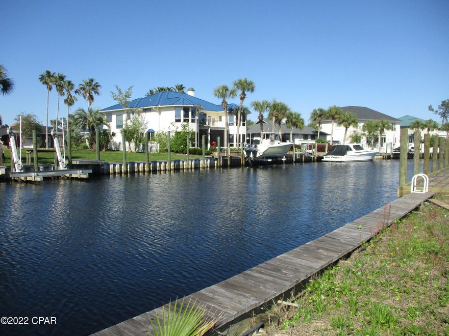Attention Boaters! This is a deep water Waterfront  lot In Panama City Beach!  A Deep Water Canal behind the gates in Bay Point. This is the only Canal lot for sale in Bay Point! Great potential to have a new construction home AND be on the canal in this great neighborhood. Build your dream home and come enjoy life on the water in Bay Point! Bay Point is a wonderful gated community where you can take advantage of walking, biking, or golf carting with friends and neighbors, or play a round of golf. Tucked away in a private community, yet just around the corner from grocery stores, restaurants and shops, the Navy Base, St Andrews State Park, and the beautiful beaches of Panama City Beach! Easy to show! Call today!