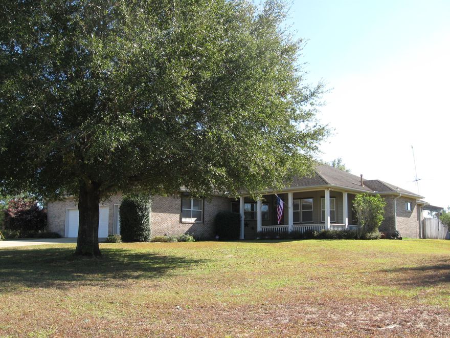 Let's go to the Country! Just north of the county line and only a hop n skip off Hwy 77 in Southern Washington County, you will find this country gem seeking a new owner. Features of this 3/2 brick home, which was built by Award Winning Koehnemann Const., includes oak floors throughout with tile in the wet areas, a split bedroom plan, large bedrooms, a Sun Room for morning coffee or yoga, an exercise room, and a garage area with workshop/storage space. Get your laps in with the 12’ X 75’ pool. The over-sized 3 car garage can hold an F150 Crew Cab with 6.5' bed and has attic storage. An outbuilding/workshop has plenty of room for a tractor and yard equipment and there is a fenced garden area; all 5 acres are irrigated. Call today to schedule your private showing of this very well kept home!