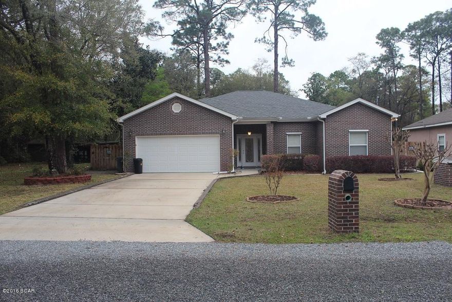 This home is located in the heart of Lynn Haven in College Point.  It's located just a couple streets down from the public boat ramp and park on the water.  It's also just about a mile from Lynn Haven's Recreation Park which includes baseball fields, walking track, indoor basketball court, park and tennis courts.  The home has been very well cared for and feels like a new home.  The fully brick exterior with vinyl trim provides easy maintenance.  The open floor plan is great for entertaining and family events.  The home features split bedroom plan, 10' ceilings, bull nose corners, recessed lights, new carpet, breakfast bar, gas fireplace and built-in hurricane shutters.  The large master bedroom and master bath feature two walk-in closets, double vanity and walk-in shower with bench seat. The back yard features a privacy fence, 10x16 shed and fruit trees.