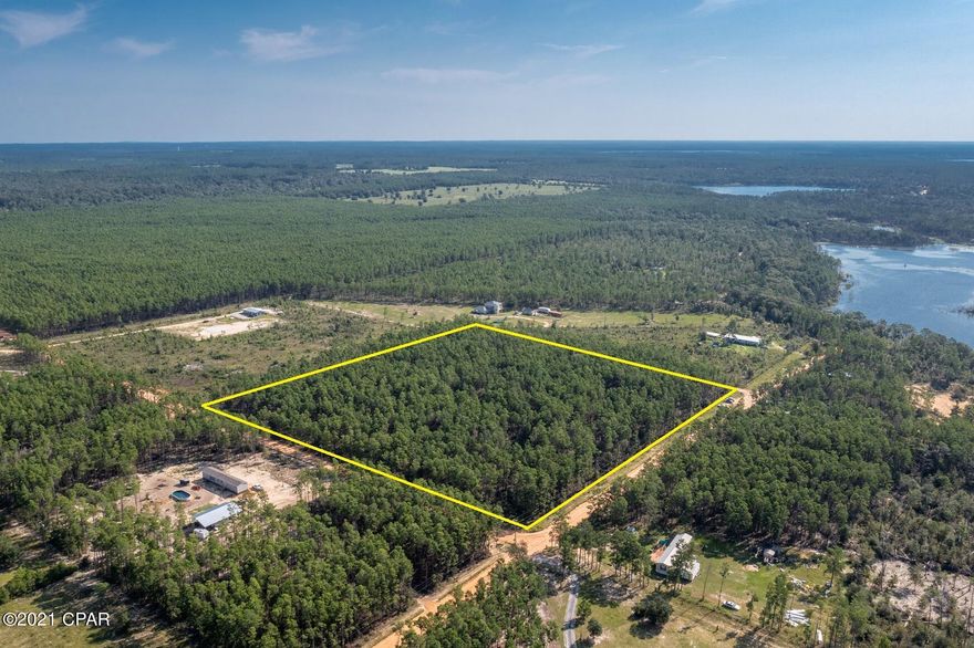 *CURRENTLY UNDER CONTRACT, SELLER ACCEPTING BACKUP OFFERS*  Nicely Wooded Corner lot... minutes away from  Crystal lake and Spring pond. Close to ECP International Airport and Panama City Beach