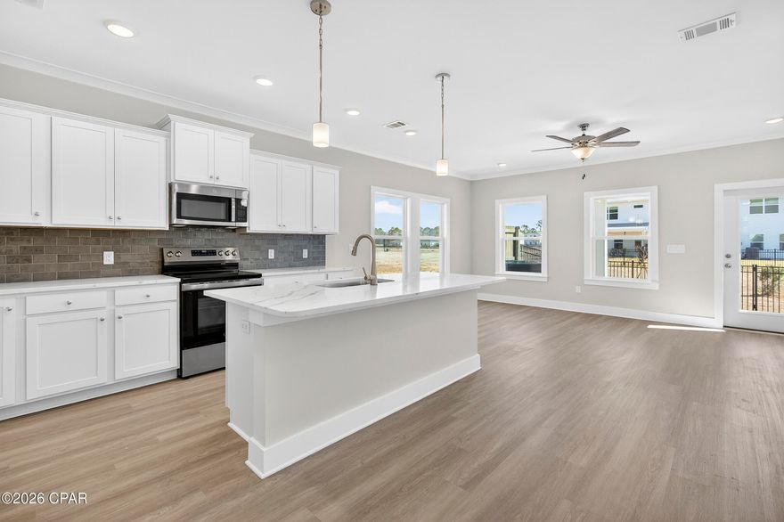 NO RENTAL RESTRICTIONS!!! Our stunning pool is NOW OPEN! The prefect place to SOAK UP THAT Florida SUN! Seagate at Clara is a new townhome community nestled in the vibrant city of Panama City Beach, FL. This two-story unit features board and batten exterior and covered entries. One car garage provides a great space for storing beach essentials. This open concept townhome boasts a stylish kitchen with white cabinets, tile backsplash, a large island with quartz counter tops - perfect for entertaining.  The elegant Owners Suite is designed with comfort in mind showcasing a large walk in closet and double- bowl vanities. Main Bath has tiled shower.  All bathrooms have quartz countertops.  LVP is located throughout the home.  The community pool features a cabana, lounging, seating and grilling stations. This community has a dedicated dog park. Seagate at Clara is in a prime location, approximately 1.4 miles to the sandy beaches and just minutes from Pier Park.