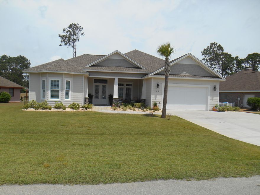 If you are looking for elegance and quality in a home then look no further than this beautiful 2017 custom built home.  This open floor plan 

4 bedroom 3 bath has tons of custom upgrades that make this a must see. Trey ceilings in the dining area, great room and master bedroom, Crown Molding in Main-Open area of home and Master Bedroom, 9ft doors thru out, Remote control ceiling fans, power room darkening shades on front door master bedroom and master bath, Plantation shutters in common areas, Recessed lighting, natural gas for the Range and back Porch Grill, Laundry room w/utility sink, Large kitchen bar area, Large master closet 8X16, Ceramic Matte PPG Paint, Porcelain Wood Tile in Random-Pattern (including Great Room Floor) , Porcelain 12X24 Tile (Upgrade Size) in Staggered Brick Pattern , Tile to Ceiling in All Baths , Added Bath Listello (glass accent tile) , Raised Bar in Kitchen , Custom Break Nook Table at Bar Height with matching Granite Top providing additional cabinet space, Ashen Blue level 3 Granite , Rectangle Vanity Sinks ,Kitchen Glass Tile Backsplash , 8# Padding on All Carpet , Irrigation Well with Rid-O-Rust System and Programmable Time ,Upgraded Appliance Package ,2x6 Exterior Walls with R-19 Insulation, Upgraded R-38 Ceiling Insulation , Completely Finished Garage including paint and Baseboard, Mechanical Room installed to conceal Water Heater and Air Handler Location , Stone Work on Front Columns ,Delta,  Brushed Nickel Faucets throughout , Upgraded Lighting Package with LED bulbs in most fixtures , Large lot with fenced back yard, pavers front entrance and back covered porch. Plus the location is in the middle of everything Panama City Beach has to offer, beaches, shopping, schools with easy road access.  Washer and Dryer do not convey with the property. Concerning the golf course, the proposed plan is to create a 3.91 acre surface water pond on the fairway and green behind this lot. See attached Permit application in the documents.