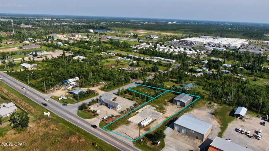 Large commercial lot and building located in the middle of a tremendous building boom. Thousands of housing units in the process of being built with a 3 mile area of this lot. Has front access as well as side road access for truck deliveries. Includes two parcels. Building is approx 2880 sq ft. Perfect location for large retail or service business.