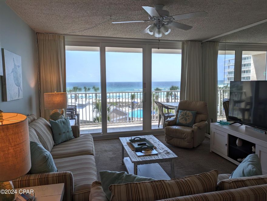 BEAUTIFUL Gulf Views - Dunes of Panama B303 is a newly refreshed 2 Bedroom, 2 Bath Condo with the most wonderful Gulf Views from every room.  It also comes with a deeded covered parking garage spot AND an enclosed walk-in storage unit. This parking and storage bring an added $15,000 to $20,000 in property value.  B303 has been on the Dunes of Panama rental program and is turnkey for renting.  Assumable bookings on the calendar OR you can own this gorgeous condo as a second home.  Newly painted, shiplap entry and hallway, tiled kitchen and bathrooms, remodeled kitchen with stainless steel appliances, beautifully furnished and comes fully furnished.  Own your own piece of paradise today!
The Dunes of Panama Resort has 1500 linear feet of sugar white sand, 3 gulf front pools (one heated), tennis courts, basketball, free WI-FI, fitness room, volleyball, shuffleboard, outdoor BBQ grills, Stingray's restaurant and gift shop and the Sneaky Tiki poolside.