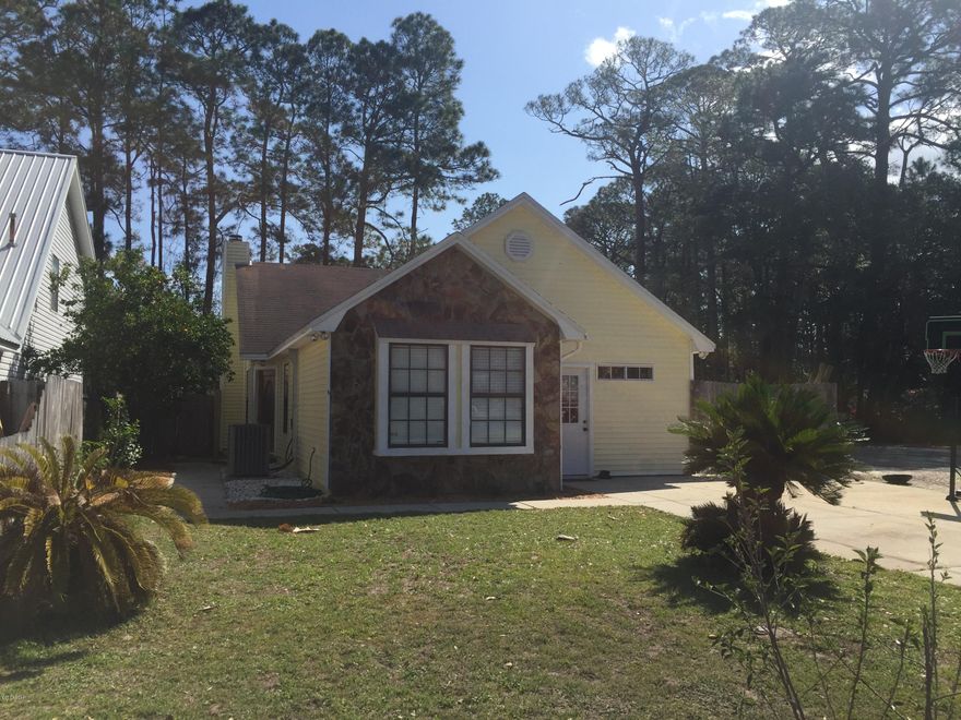 NEW ROOF on this well maintained home centrally located in St. Andrews.  This 3 bedroom 2 bath home has been updated with a new kitchen, new bathrooms and A/C system was replaced in 2013.  The living room has cathedral ceilings and a stone wood burning  fireplace.  The large fenced backyard has large covered patio plus a place to store your boat or RV.  This home is located on a corner lot and is close to everything.