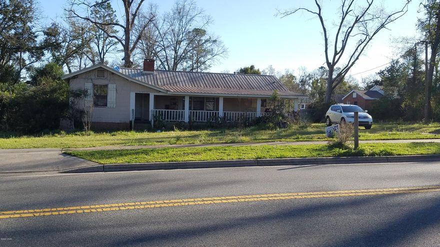 **CURRENTLY UNDER CONTRACT, SELLER ACCEPTING BACKUP OFFERS** Here is a Great Opportunity to Make this the perfect home. This home has so many possibilities! This 2 Bedroom 2 bath has 1568 sq ft under air, with a family room that has a closet and can be easily converted to a 3rd bedroom! There are original hardwood floors that are in good condition! Located in the city limits of Marianna and sitting on .87 acre! Large laundry room. Relax on the 12x38 front porch. This home will not last long so call for more information today!