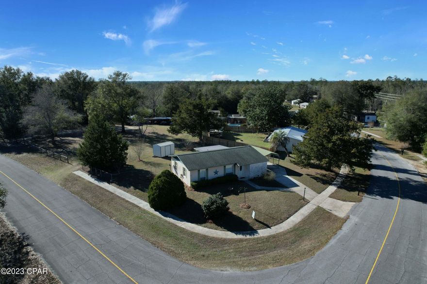 Under Contract Seller Taking Backup Offers Charming two bed 1.5 bath home nestled on a corner lot in peaceful Sunny Hills. The home has an open concept, a sizable kitchen, and a large screened-in back porch. It also has a storage shed and a fence ready for your furry friends. Cozy and quiet, and it is perfect for someone who would love to enjoy all the benefits of living close to Panama City Beach without having to live in the hustle and bustle. Enjoy the nearby caverns and State parks, golf course, community center, Boat Lake, Blue Lake, Gap Lake, or Holmes Creek with your family. Schedule a showing today and see if this is the place you will call home.