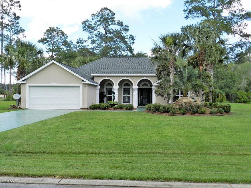 Immaculate Florida Home - This 3 BR,2 Bath single family home has dramatic column/arched covered entry porch & French door with side light panels.Located on a quiet private cul-de-sac in Paradise Cove Subd only a short walk to the beach! Lg living room has fireplace with gas logs, 9' ceilings,surround sound stereo speakers,crown molding,french doors that lead to back covered patio area overlooking beautifully landscaped yard w/private gazebo. Kitchen has white wood cabinets,granite countertops,eat-in-bar,& breakfast nook w/bay window. Master suite has tray ceiling w/crown molding,arched bath entry w/double vanity,whirlpool garden tub w/glass block window,separate shower and walk-in closet.New carpet,newly painted interior & exterior.Driveway & entry walk way are scored & stained concrete