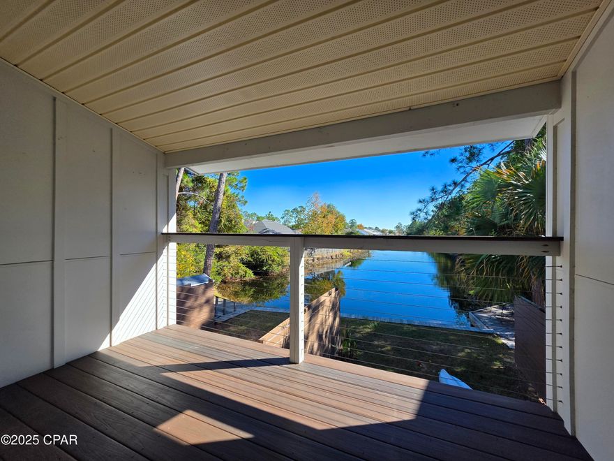 CURRENTLY UNDER CONTRACT, SELLER WILL CONSIDER BACKUP OFFERS ! 

Survey available! MOTIVATED SELLER! 

Wake up to tranquil canal-front views and end your day with beautiful sunset reflections — this beautifully updated 2-bedroom, 2.5-bath townhome delivers a luxury coastal lifestyle at a value price. Enjoy low-maintenance living with an effortless connection to the water and nearby beaches. The heart of the home is a refreshed, chef-friendly kitchen featuring sleek quartz countertops and stainless steel appliances, opening to a light-filled living area finished with durable ceramic tile flooring — perfect for sandy toes and easy cleanup after a day of adventure.

Position yourself for unbeatable equity. This property offers the opportunity to step into a sought-after coastal market at a discounted price point — securing lifestyle, location, and long-term value all at once. Whether you're building wealth, downsizing smartly, or purchasing your first home, this is a rare chance to buy below the ''luxury lifestyle'' threshold while still enjoying all its benefits.

Big-ticket upgrades create power and peace of mind. A new roof in 2019, new HVAC in 2020, and a newly replaced seawall in 2024 mean the major expenses have already been handled — allowing the next owner to focus on living, not repairing. Upstairs, both bedrooms offer privacy and calm, and the staircase and bedrooms feature brand-new carpet for a fresh, comfortable feel underfoot.

Step outside to a delightful backyard that feels like your own private retreat along the canal — perfect for romantic dining, relaxing with a glass of wine, or launching a kayak or paddle-board to enjoy the calm water right behind the home. It's the kind of indoor-outdoor flow that makes every day feel like vacation living without the luxury price tag.

Location amplifies everything. Two assigned parking spaces are directly at your front door, and you're minutes from grocery stores, local dining, entertainment, the Navy base, and all the amenities of Panama City — with sugar-sandy beaches just a short drive away. Convenience, lifestyle, and value align perfectly here.

Stylish, move-in ready, and designed for relaxed Florida living, this canal-front townhome invites you to slow down, breathe in the fresh air, and step confidently into your next chapter. Schedule your private showing today — this one won't last!

A survey is available for the next owner. Buyer to verify all information deemed important.

Homeowners Insurance $3314 per year
Flood Insurance $1187 per year
FPL $175 month
PCB Utilities $115 month
Xfinity $55 month
No Pending Assessments at this time
HOA Fee 178.50 month