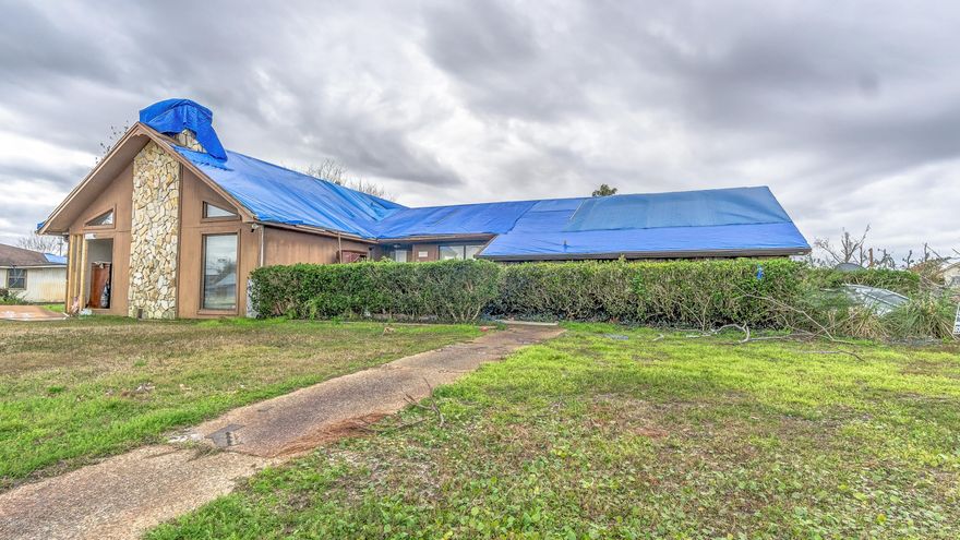 Fantastic investment opportunity!! large spacious house in well known Derby Woods neighborhood on Collage Point. This home sits on a double lot, this property features a large  8 foot deep pool, out building and plenty of yard space. in the Home you will find an over sized sunk in living room, large kitchen and dinning room, ample closet and storage space, fire place and high vaulted beamed ceilings.  This home has damage from Hurricane. but will make a fantastic investment!