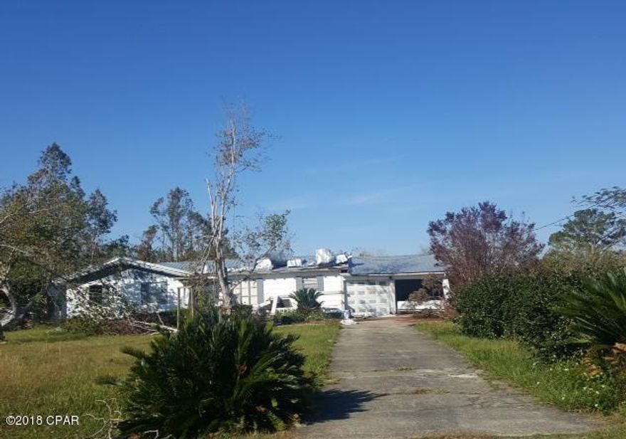 Room to roam with this one acre fixer upper on paved road in Wewa. Home features 3 bedrooms 2 baths and did sustain some damages during hurricane Michael to the garage , front porch, and front roof cap of home. This property is part of the FNMA first look program. That allows owner occupant buyers to have their offers negotiated on day 7 of being listed. Investor offers are negotiated on day 20 of listing. Sold as-is where is.