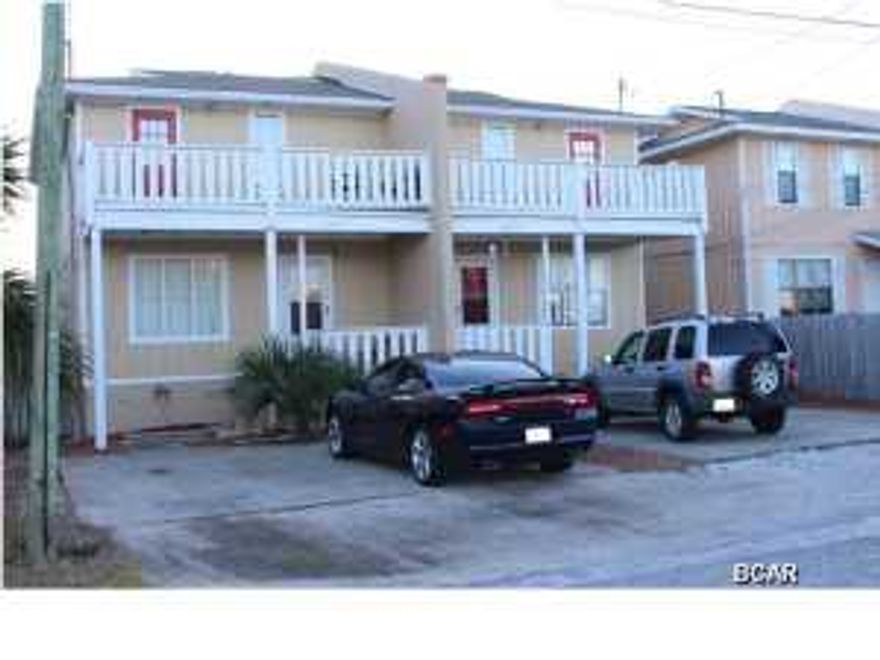 Walk to the Beach! Two story town home duplex with partial views to the Gulf of Mexico. Each side has 3 bedrooms and 2 baths. Keep as investment property or live in one side and lease the other. Other property features include a covered rear porch, storage room and privacy fenced yard. This property is priced to sell! No association fees!!!New Roof! New AC Units! New Appliances!