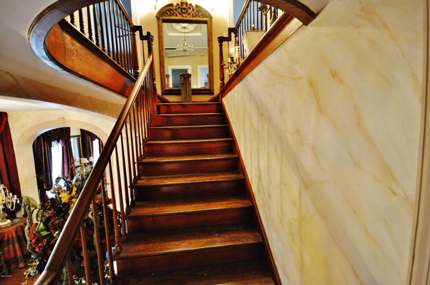 You will want to see this Southern mansion, right on main st in Chipley. The home features a beautiful hardwood staircase, formal dining room, 10 ft ceilings throughout, eat in kitchen with built in cases, 2 gas fireplaces, a library, huge bedrooms, and a large sunroom on the southside of the house. Where can you find a home built like this anymore? During the storm a lot of the houses around it were severely damaged yet this stood tall. Schedule your appointment to see right away. I have pictures of how beautiful the landscaping was before. Seller will sell furniture. All sizes are approximate.  Please measure if important