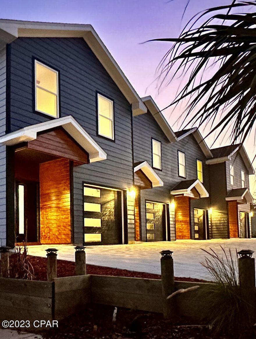 Priced below the $379,000 appraisal, this newly constructed luxury townhomes are just minutes from St. Andrews Marina and all of the fine dining and nightlife it has to offer! The perfect location for all of the downtown festivities yet far enough away for peace and tranquility. Downstairs features a kitchen, dining, living room combo along with a half bathroom for your convenience. Enjoy an early morning cup of coffee or an afternoon glass of wine on the back deck.  The heated/cooled garage features an insulation garage door, making it perfect for an office space, craft room or home gym. Upstairs is a massive master bedroom with extra large awning covered windows. On a good day you may even catch a glimpse of the bay! The master also features a walk-in closet and master bathroom with champagne fixtures. There are two additional bedrooms down the hall with a full bath and laundry room. The townhomes have a party wall agreement with no HOA.