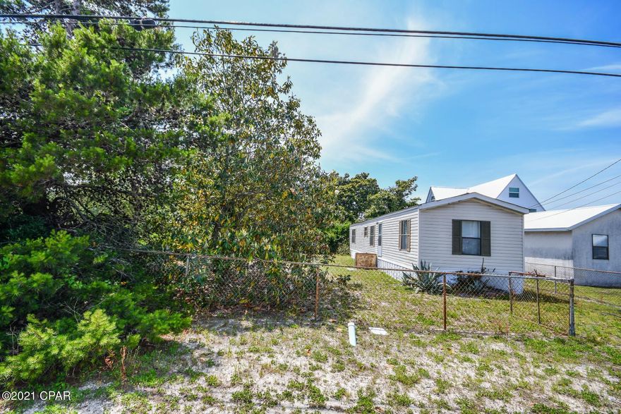 Perfect beach house in a peaceful neighborhood just blocks from the beach.  NO HOA Close to shopping, restaurants, the Navy Base, schools and more! This 2br/2ba is fenced in and well maintained and would be perfect as a vacation home or primary residence. The roof was damaged in Michael and there is damage in the small front bedroom ceiling. Ride your Golf cart to the beach, Walmart, Nicks Pizza, Salty Goat, the county pier, Saltwater Grill, Firefly, Rocket  Lanes... there is so much to do in this area of the beach. All sizes approximate please measure if important.