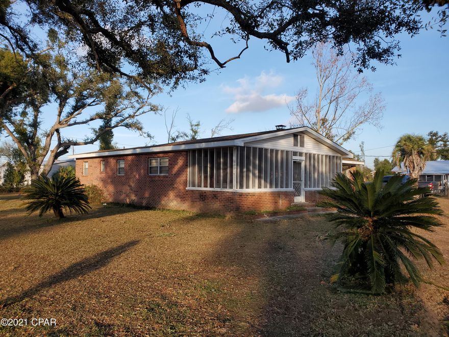 This 5/2 with a fireplace just outside of Lynn Haven is sitting on a beautilful 1.25 acre parcel. Featuring a detached 3 car garage, and a detached single carport. This well maintained home is ready for new owners. 

This quaint Florida Style home has an eat in kitchen, Large living/family room, 5 Bedrooms, and 2 baths. The large screened in patio is perfect for relaxing afternoons. If you are looking for a bit more space than what you can find in town but close enough to everything. Look no further. This is the one to see. To make this your forever home contact an agent today.