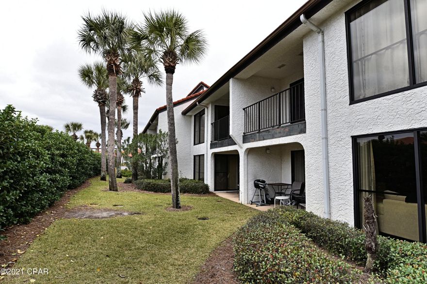 NEW LISTING! Second floor, no one above you. Spacious split floor plan, generous room sizes. Newer AC and Water Heater. Raised kitchen ceiling, Stainless Appliances. Walk-In Closets. Offered fully furnished so ready to earn rental income and pay for itself. Imagine your own beach get-a-way! Relax on the covered Patio and enjoy coastal breezes. Just steps to the private, heated Villa Pool. Golf, Gym, Tennis, Pickleball, Kids Club and more included in the HOA Dues! Incredible tropical amenities! Heated and Gulf-Front Pools, Hot Tubs, Sun Decks. Delicious Restaurant, Market, Pizza, Poolside Bar. Walkable to retail center, restaurants, bowling, arcade, skating, sports bar, shopping. Pet friendly for owners. On-Property tram service. Manned, Gated entrances.