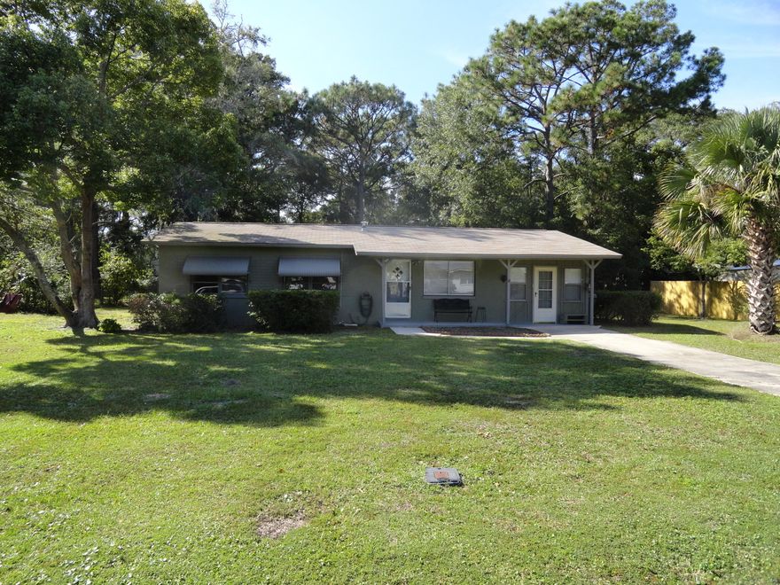 Handyman's Special in Lynn Haven! This 3 bedroom 1 bath house needs a kitchen renovation, new flooring throughout, paint and a few minor touches to be move in ready! Re-roofed in 2010 the roof and HVAC are in great condition.  The house is concrete block so it is sturdy and will make a good solid home. The garage was renovated to make an additional living space and there is a laundry/utility room.  The back screened porch looks over the enormous backyard.  This 1/3 of an acre lot has a yard building included.  A great starter home in the best school district in Bay County.  Don't miss this one!