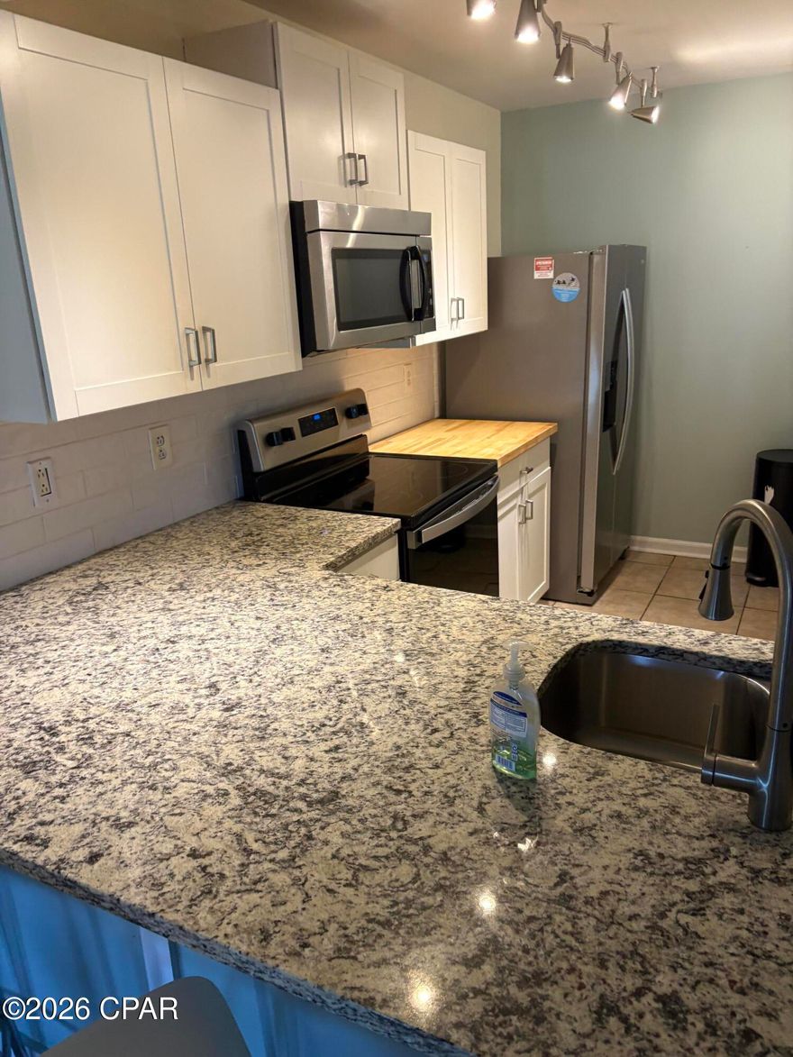 Beautifully renovated ground-floor villa with pond and golf course views! This spacious condo features an open floor plan, private covered patio, large primary suite with private bath, and a guest bedroom with convenient bath access. The unit includes a fully equipped kitchen, full-size laundry, and brand-new furnishings and appliances. Located just steps from the heated Villa pool, with pet-friendly ownership. Enjoy easy beach access and resort-style amenities including tropical pools, hot tubs, beachfront restaurant, poolside bar, market, pizza shop, Kids Club with splash pad, and more. Owners enjoy unlimited golf, tennis, pickleball, and shuffleboard, plus access to the fitness center, pro shop, and salon services. Gated community with 24-hour security, within walking distance to dining and entertainment.