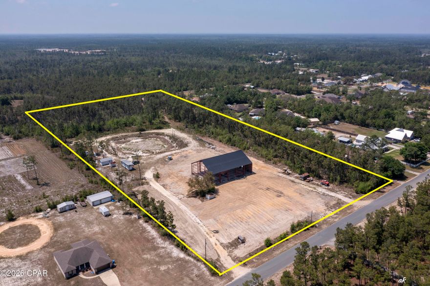 Highly Motivated Seller!  11 ACRES! Bonus! Seller will remove the existing red iron building and offer a $50,000 price reduction, creating added flexibility and opportunity for future use of the property. Rare opportunity in booming Southport! This 11-acre property offers the space, privacy, and flexibility that is almost impossible to find today. Located on a paved road with no HOA, this property gives you the quiet lifestyle people want while still being close to everything--about 10 minutes to Lynn Haven, 20 minutes to the airport, and 30 minutes to the beaches and Pier Park.
With new construction and growth expanding north, this is a prime opportunity for a private estate, family compound, or potential subdivision for multiple homes or spec builds. The property already has septic, well, power, and full camper hookups on site. There is plenty of room for your RV, boat, heavy equipment, and all the toys, plus space to create your own micro-farm with chickens, horses, goats, and more. A massive red iron building has also been started, offering approximately 14,000 square feet of heated and cooled space when completed. Permits are pulled, and a floor plan is available.
Whether you are looking for land, privacy, investment potential, or room to build something big, this Southport property is an opportunity worth paying attention to, come tour today!