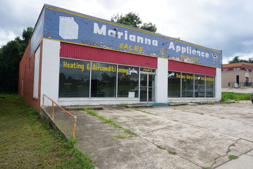 Great location for a retail store. This property is located right across the street from Winn-Dixie Grocery Store in one of the busiest sections of Marianna, FL. This building was being used in the past as an appliance retail store. This building itself has a retail area in the front and warehouse storage in the back of building. The building is in need of repair and is priced accordingly. HURRICANE MICHAEL UPDATE: windows were blown out; please contact listing agent for more details.