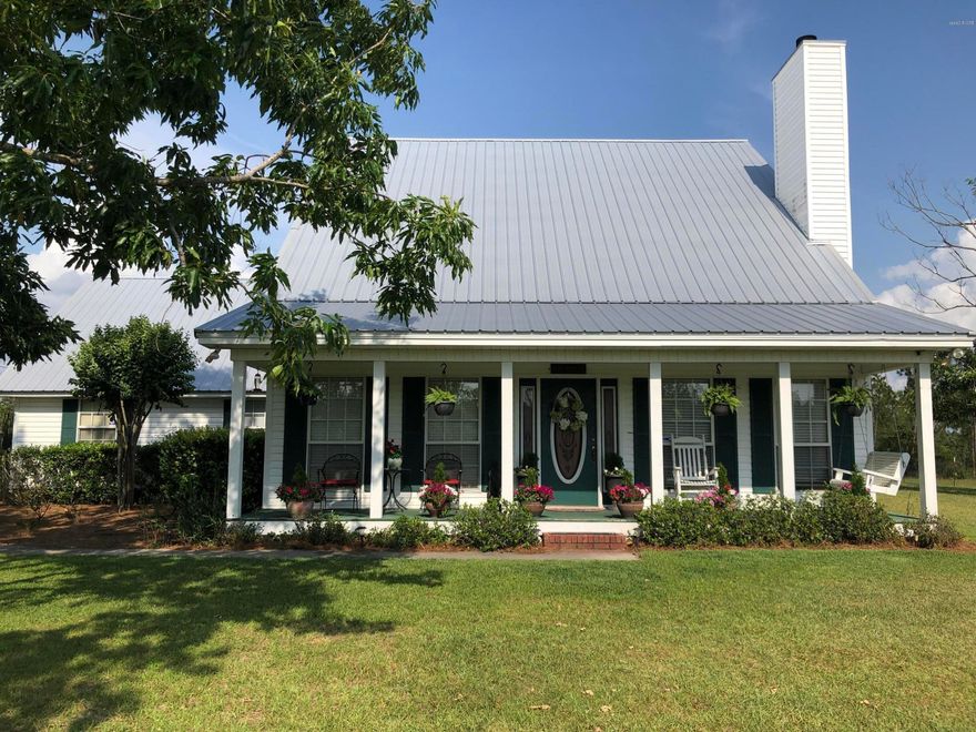 Price is firm. ... No low ball offers please. Incredible 10 acre country estate with everything on your list. This country home sits on a property with plenty of open pasture land interspersed with wooded areas. Neighbor properties include large wooded tracts and State Wildlife Management Area. As you enter the picturesque driveway there are fish ponds on the left and woods on the right that screen the home from the road. The home sits to the rear of the property affording the maximum of privacy. The wide porch invites you to sit on the swing and watch the variety of wildlife that visits the property daily. As you enter the home a formal dining room lies to the left and the living room to the right. The living room features a huge woodburning fireplace and woodplank flooring. As you enter the home a formal dining room lies to the left and the living room to the right. The living room features a huge woodburning fireplace with woodplank flooring. The kitchen has new stainless steel Kenmore appliances and beautiful quartz countertops. The dining area has french doors that open onto a screened patio overlooking a fenced back yard. The spacous master bedroom is also conveniently located on the first floor. Upstairs are three nice bedrooms and a full bath. The outside areas of the property are equally amazing with a 32X48 barn for all your toys. To the rear of the barn is a huge fenced garden area large enough to support any size family's needs. The home has a metal roof, total electric with newer twin split A/C systems providing efficient energy use and a new 4 inch well serves the property. Large pasture areas with native and pecan trees are perfect for a family that would like to have horses, cows or pets of any kind. On the north side of the property, on adjoining 10 acres is a larger 2-acre fish pond providing a perfect place to relax, boat or fish. Don't spend years trying to build that perfect property. If you want county home surrounded by wildlife, this is it  This country home has everything you could want turnkey. The south 1/2 of property is offered as 10 acres with home, barns and all the necessary amenities to operate a horse farm or grow whatever your heart desires.This is part of a 20 acre tract and it can be purchased all or part. 

Please call for an appointment to see this great property. EASY TO SHOW, EASY TO LOVE.