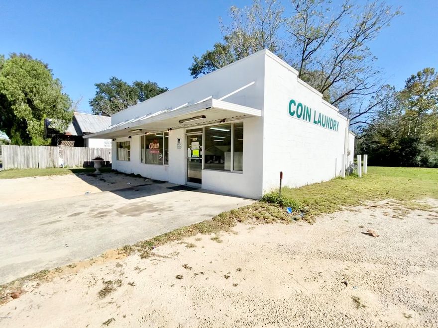 Commercial investment opportunity located on a busy intersection! For years this building has operated as a laundromat serving the Chipley area. It currently houses 25 coin-operated washer/dryer units, security system, laundry bag dispenser, soap dispenser, and folding table. In the back of the building there is a utility/storage room and bathroom. All machines will convey with the sale, approximately 50% are operational- buyer to verify. The intersection this building is located on runs through Dothan to Panama City and is highly travelled! Prime location to own an investment property. Included in the sale are two adjoining lots, making the property the entire end of the block from 77 to 7th St. With the adjoining lots you have the lot, , sell them separately, or build your next business venture. This laundromat was operating until just recently and is ready to be back in order. Coin changer does not convey.
