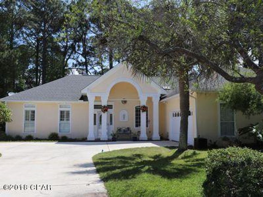 GREAT FLORIDA HOME!  NO STORM DAMAGE! Charming home built in 1991 as a model home and featured in the Parade of Homes.  GREAT SETTING AND LOCATION!  New roof in 2010.  Owners have provided this home with much TLC.  Open floor plan w/split bedrooms, marble fireplace facade, crown moldings,  elegant columns and archways in formal dining area.  Expansive master suite with large walk-in closet.  Screened porch overlooks lake.  Home had no storm damage - ready to occupy.   A HOME to ENJOY!