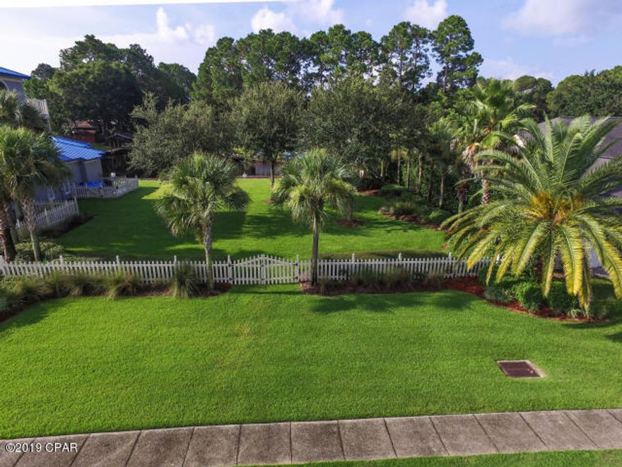 CURRENTLY UNDER CONTRACT-SELLER WILL LOOK AT BACKUP CONTRACTS. Brand new dock!! This is the best waterfront lot to build on in Panama City Beach! This lot comes with a boathouse and a seawall! Its' location allows you convenient access to our beautiful waterways such as St. Andrew's Bay, the Gulf of Mexico and our intercoastal canals. With Dolphin Bay Marina close by, getting to where you need to go, will never be an issue and you will always have a front row seat to Fourth of July fireworks! This parcel includes a home that can be purchased as well or sold separately. Please see MLS 683775.