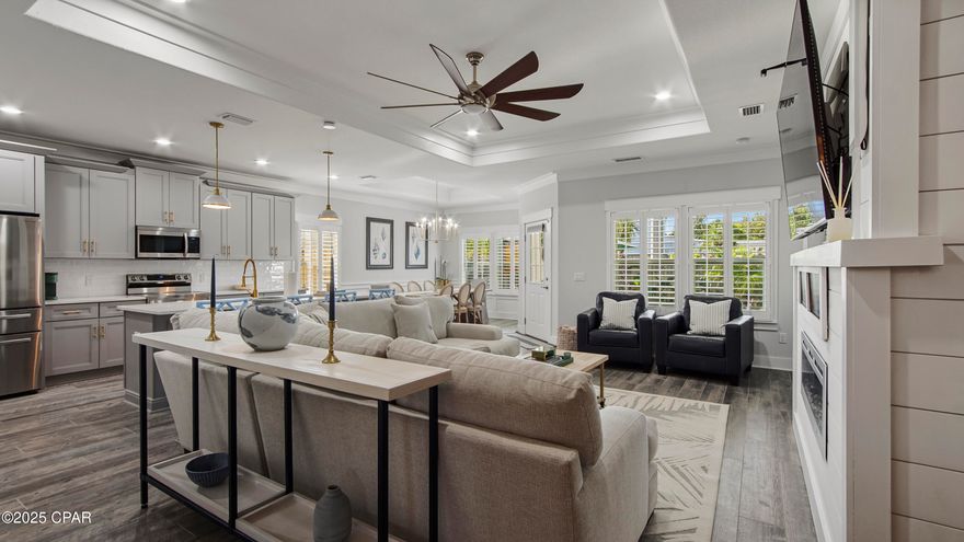 Effortless West End Living with Private Golf Cart & Outdoor Oasis, escape to the quiet side of Panama City Beach in the gated community of Laguna Haven. This pristine 2022 coastal retreat offers a rare blend of luxury, energy independence, and turnkey convenience. Whether you are seeking a primary residence or an investment (projected $47k+ annual gross), this home delivers.

Beach days are a breeze with the included premium six-seater golf cart, whisking you to the sands of the West End or nearby 30A dining in minutes. Inside, the upgraded Calabria plan welcomes you with soaring 9-foot ceilings, plantation shutters, and a custom entertainment center with a cozy fireplace. The flow is seamless, moving from the chef-ready kitchen—featuring upgraded cabinetry and premium appliances—to the open living area designed for gathering.

The climate-controlled garage offers a versatile bonus space for projects or storage, while the owned solar panels (paid by seller) ensure immediate monthly savings. Retreat to the primary suite, a true sanctuary with tray ceilings, a custom walk-in closet, and a spa-inspired bath with backlit mirrors. Step outside to your private evening escape featuring a covered patio, relaxing hot tub, and widened paver patio surrounded by lush landscape lighting. A flawless balance of modern elegance and beach town ease. Schedule your private tour today.