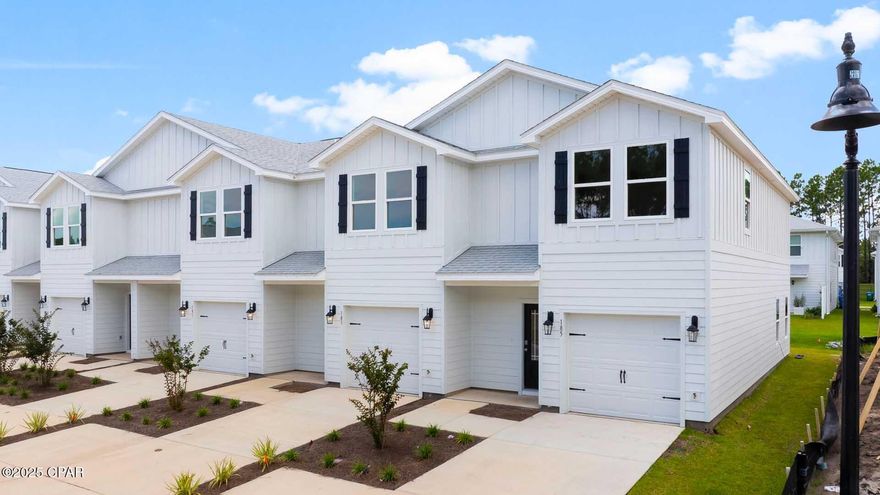 Welcome to 189 Ellery Lane at Bayside at Ward Creek in Panama City Beach Florida. This townhome is ready for move in and offers a welcoming space that has 3 bedrooms, 2.5 bathrooms, and a convenient single car garage. The bright entry leading to an open kitchen, living, and dining area that is designed for comfort and everyday living. The kitchen serves as the culinary center with a spacious center island, beautiful white cabinetry, granite countertops, and a premium stainless steel appliance package including a smooth top stove, microwave and dishwasher.  

   

The first floor is the heart of the home, while the privacy of the second level has all bedrooms, ensuring a quiet retreat. The main suite features a generous closet, an oversized shower, dual sink vanity, and a linen storage area in the private bath. Two additional bedrooms share a hall bath with shower tub combo that create a comfortable space for family or guests.  

   

The interior features include EVP flooring throughout the main level and second level bathrooms and plush carpet on the stairs, upstairs hallway and bedrooms, Smart Home Technology Package comes standard, featuring a Qolsys IQ touch panel for thermostat and lighting control, ensuring security and convenience. Exterior features of Bayside at Ward Creek townhomes are equally impressive, with Hardie® siding and thoughtful lighting at the garage, front entry, and back patio. A landscaped front entry adds curb appeal and welcomes you to your very own slice of Florida paradise awaits. Call today for a tour of this floor plan. Drawings, renderings, photos, square footages, floor plans and sizes are approximate and for illustration purposes only and will vary from the homes as built. Not all features available on all plans. Elevations and exterior materials may vary.