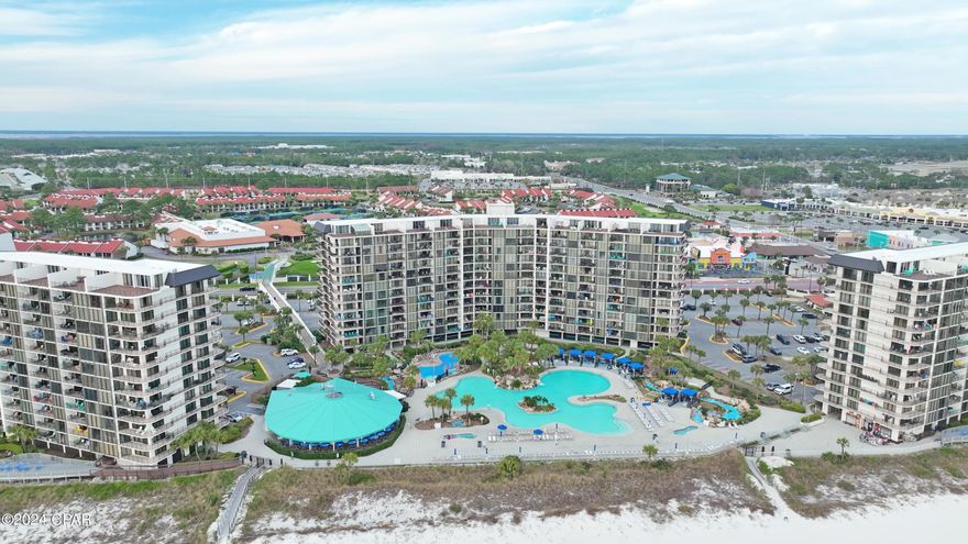 OWNER MAY PAY THE REST OF 2024 CONDO FEES WITH AN ACCEPTABLE OFFER.  EDGEWATER BEACH is one of Panama City Beaches premier vacation destinations.  This is what I consider a ''Stand Alone Complex'' meaning it has almost everything most people would need while on vacation.  Between whats on site and what is in easy walking distance there is just about everything except grocery stores.  This unit is located on the second floor overlooking the pool and hottub area.  This comfortable unit is on the onsite rental plan and generates a good income each year for the owner.  This is the larger 2-Bedroom style unit available.  The extra living area gives owners and guest that larger feel with more living space.  The oversized kitchen has  updated granite tops, and cabinets, lots of counter space and the breakfast bar easily seats four.  The large dining room and living room all have 8-foot floor to ceiling windows to maximize the beach and ocean views.  The flooring throughout the unit is all diagonal tile except plank flooring in both bedrooms.  This  really helps keep the unit cleaner.  The sliding glass doors  in both the living and the dining room are new.  The second floor location is convenient and is certainly often requested by renters.
Edgewater has just about every amenity someone could want.  In addition to all the pools, (over a dozen at your disposal) including the main huge free form tropical pool, there are numerous hot tubs to enjoy.  Fitness centers, 3-par golf course, a tennis center, walking & jogging paths, and a convention center.  The convention center enables Edgewater to generate a lot of additional room rentals that normal complexes don't have.  There are overhead crossovers to keep out of traffic.  Onsite HOA and Rental offices are available for owner and guest convenience.  Nearby in easy walking distance are a number of eateries from fast food for folks on the go to the more refined dining found at the Firefly Restaurant.  Waffle shops, Subway, rental operations, skating rink and bowling alley, and retail are all just a stones throw away.
The County Pier is located just a mile west and Pier Park is only about 3.5 miles away.