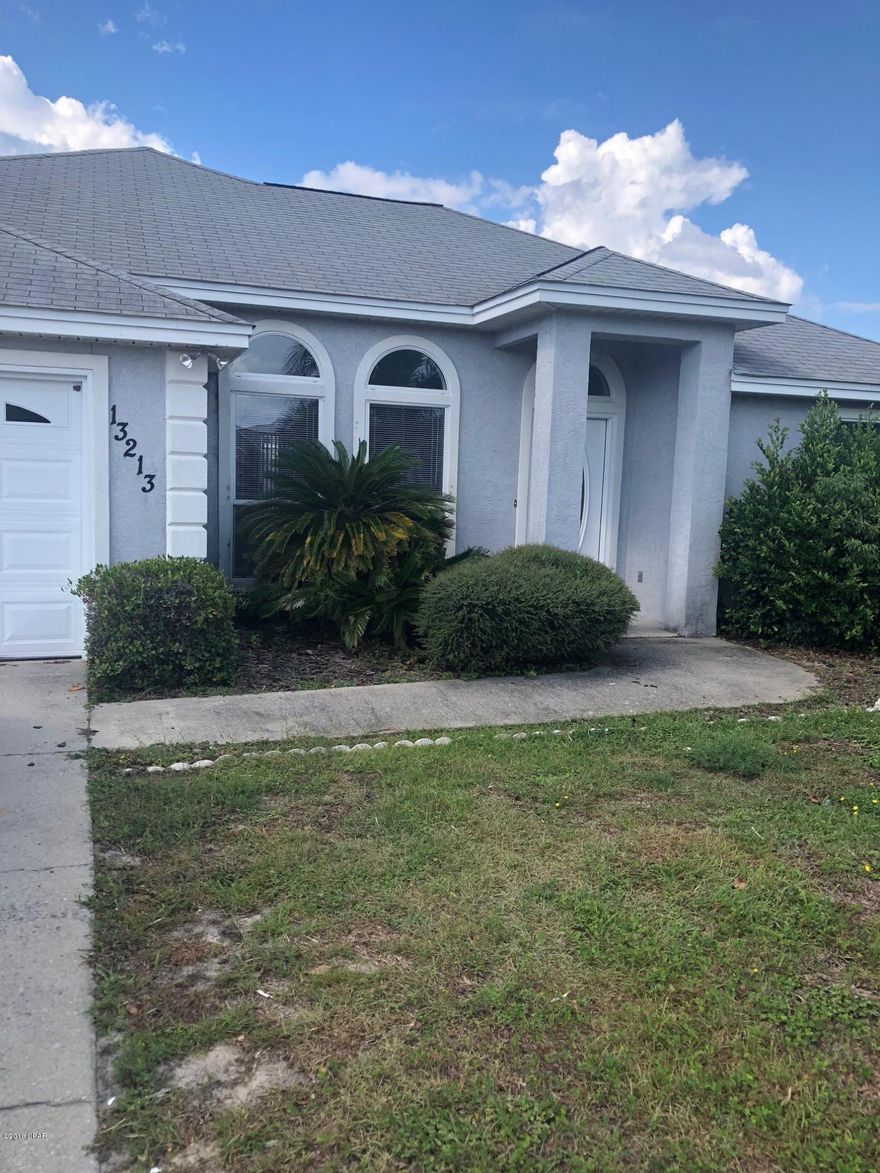 Great 3 bedroom home in central Panama City Beach.  Just a few block to Beach Elementary, and only a short walk or golf cart ride to the beach.  This home has recently been completely repainted inside with new flooring in the bedrooms.  Large fenced in back yard and a 2 car garage.