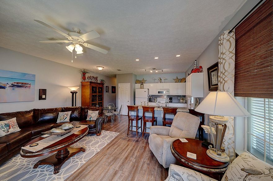 WALK TO THE BEACH! You will fall in love with this bungalow as soon as you open the door! This duplex features vinyl flooring, granite countertops, tons of storage, three big bedrooms, two full bathrooms, washer & dryer, a deck off of the master bedroom and a yard shed for the golf cart! This place has been very well maintained and beautifully decorated! The water heater is in great shape and the HVAC was replaced in 2017. This is not currently a rental but it would make a perfect vacation rental or home!