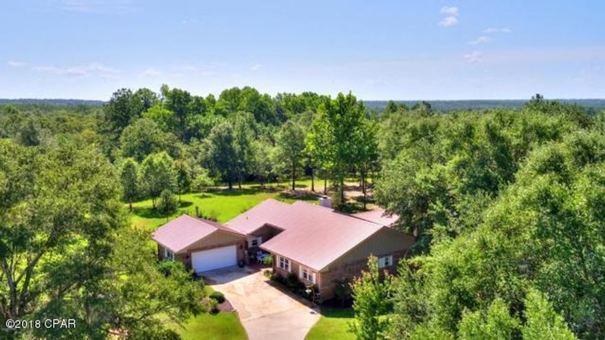 One of the most awesome farms you have ever seen!  This beautiful 36+ acre farm is completely fenced and perfect for horses or cattle.  The home is 3 bedroom 3 bath all brick and hardie board construction.  All top of the line amenities including a Thermidor range, Bosch dishwasher and a brand new french door stainless refrigerator with custom imported mesquite island counter top with all other counter tops being high end quartz.  Each side of the home has its own water heater and septic system.  For the cool nights it also has a large wood burning fireplace.  There is also for your convenience a whole house generator.  Off the back of the home there is a large patio over looking a custom made fountain and the wooded area of the property. There is a huge barn - 48 x 96 feet that is all foam insulation with plenty of room for storage of tractors, boats, cars, motor home and more.  Also in the barn is a large studio apartment for your guests or mother-in-law.  The over sized garage is heated and cooled.  There is a 25' x 25' outdoor screened in entertainment area with ceiling fans and grill area.