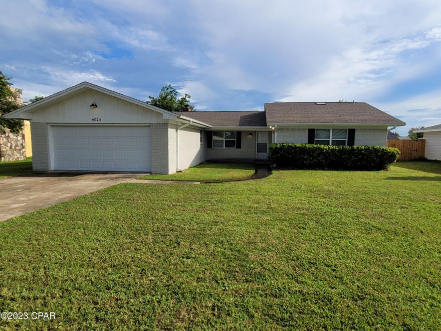 Spacious 4-bedroom 2 bath home with 2 car garage, covered front porch, privacy fenced backyard, large coved patio with open patio.  This home features a foyer, living room with non-operational fireplace, sliding glass doors to the covered patio, open kitchen/dining area, laundry room with washer and dryer hookups, bedroom off the kitchen can also be used as an office, skylights in the bathrooms, master bathroom changing area and walk-in closet, LVP flooring in the common areas and carpet flooring in the bedrooms.  Utility sink in the garage and home is all electric.