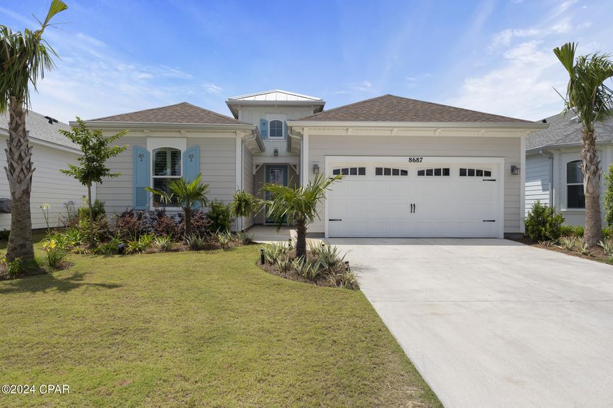 Introducing Latitude Margaritaville Watersound, a new 55+ community in Florida's panhandle region near Panama City Beach and the scenic 30A corridor. This brand new Coconut Plan home is packed with upgrades, offering a luxurious lifestyle for its residents.

Step into the kitchen and be greeted by cabinets featuring a soft close feature, pantry pullouts, and a pots and pan drawer. The kitchen and bathrooms boast elegant quartz countertops, complemented by upgraded faucets and a stylish tile backsplash. The bathroom cabinets have also been upgraded, and the master bath features a double bank of drawers.

Enjoy the premium tile flooring in the bathrooms and laundry area, while the master bedroom and closet feature beautiful wood flooring. Crown molding adorns the entire house, adding a touch of sophistication. Stay comfortable with ceiling fans and lights throughout the home.

The living room is enhanced by decorative beams, creating a cozy and inviting atmosphere. Relax and unwind in the screened-in lanai, perfect for enjoying the Florida weather. Additional features include extra plugs, an attic pull-down, and a glass front door.

Don't miss the opportunity to be part of this exceptional 55+ community. Contact us today to schedule a viewing and experience the Latitude Margaritaville Watersound lifestyle for yourself.