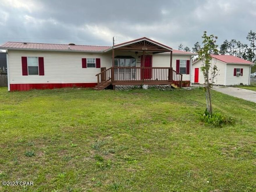 Enjoy the quaint residential area of Sweetwater Village! This 3 bedroom/2bath mobile home has many lovely features to include a new metal roof, open floor plan, split bedroom plan, covered patio front and back,  fenced back yard, and a yard building.  Enjoy a lovely electric fireplace in the large living room. The master bedroom is roomy and has an ensuite bathroom with garden tub, separate shower and double vanity. There is a separate laundry room and two additional bedrooms.  One of the bedrooms has a murphy bed for convenience.  Call your favorite Realtor today to view personally.  All measurements are approximate. Buyer to confirm if important.
The titles have been retired making this mobile home Real Property.

Murphy bed mattress, washer & dryer, and window air conditioner in the yard building do not convey.