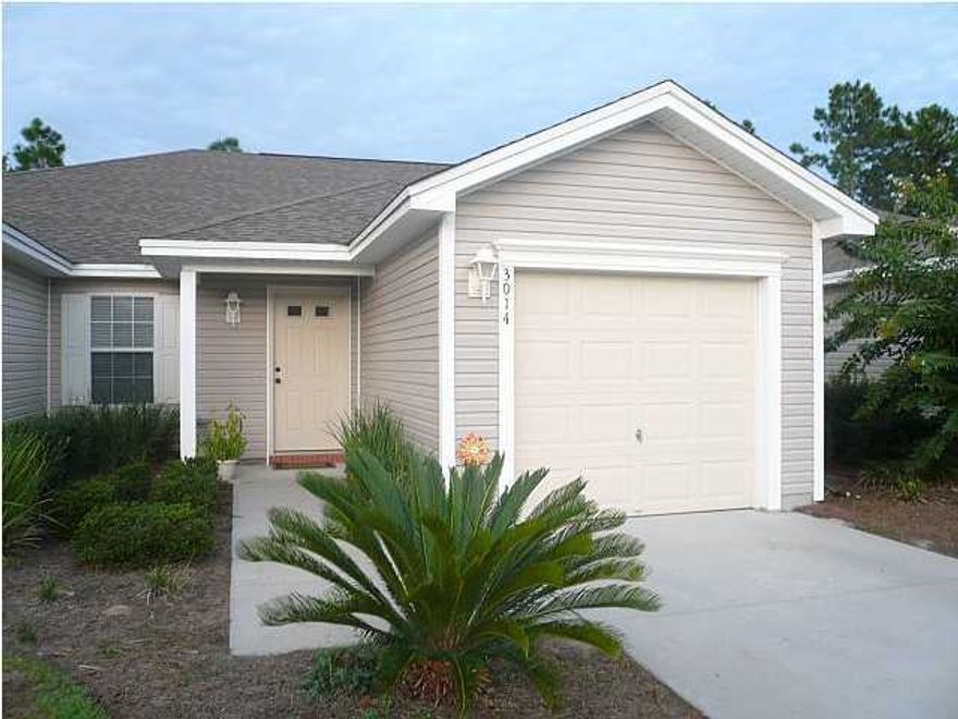 CENTRALLY LOCATED ATTRACTIVE HOME IN A GREAT COMMUNITY!!! The interior of this nice home features 2 bedrooms, 2 full bathrooms, a large eat-in-kitchen, an extra dining area, a great open floor plan, a one car garage, tile in the living room, kitchen and bathrooms and hardwood flooring in the hallway. The kitchen features ample counter space and cabinets, beautiful granite countertops and a huge breakfast bar. The master bathroom has a double vanity with plenty of counter space and cabinets, a walk-in closet and a regular closet. The exterior features a patio for grilling or relaxing, attractive landscaping and sidewalks. The association maintains your yard! In addition, take advantage of the community pool!! The neighborhood is very well kept and is close to shopping,