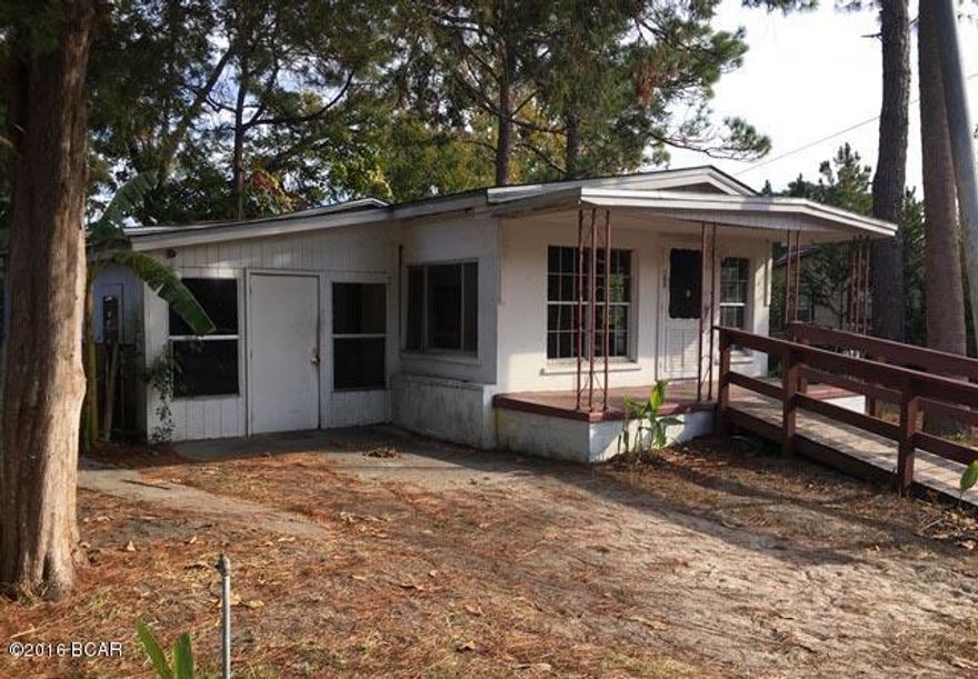 This spacious cottage in quaint Port St. Joe has 3 bedrooms plus a bonus room. The living room has a brick fireplace and lots of windows.  This home would be a great rental for investors or a kid friendly family home!