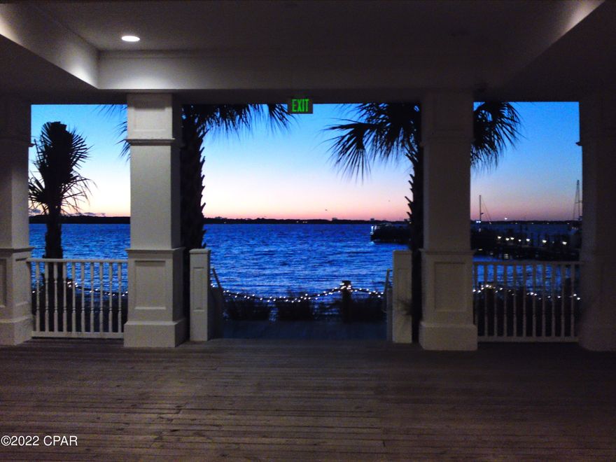 Enjoy St Andrews sunsets from private balcony. Wake up  to calm lapping of bay waters onto shoreline.  Listen to breeze in the palm trees as you enjoy the charm of life of a gated community with only 116 condos.   This unfurnished condo has fresh paint and new flooring.  Washer & dryer and blinds make this move easy.  Community  pool and fitness center provide a life style that resemble a vacation. Garage parking for 2 cars.