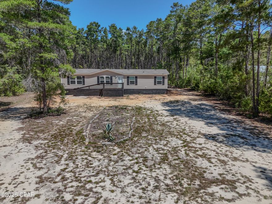 Move in ready home in Panama City on large 0.75 acre lot with private backyard and no HOA. Ideal for buyers searching homes with land in Panama City, large lot homes, or no HOA homes near Panama City Beach. Freshly painted with new appliances, this move-in ready home offers modern updates and flexible living. Ample space for RV parking, boat storage, outdoor living, or future expansion. Located about 25 miles from Panama City Beach and the Gulf of Mexico with easy access to beaches, fishing, shopping, dining, schools, and major roadways. Great primary home, second home, or investment property. Investment loans now available and seller financing options available with zero down payment programs for qualified buyers.