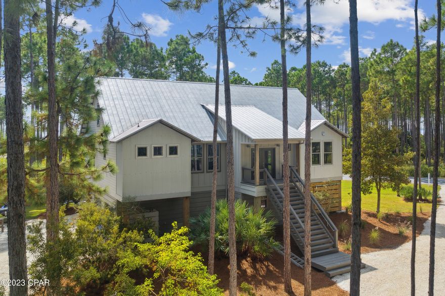 CURRENTLY UNDER CONTRACT, SELLER WILL CONSIDER BACKUP OFFERS Newly renovated 5 bedroom home in beautiful Rivercamps with great views of West Bay and the intercoastal waterway. This open floor plan home has been completely remodeled with all new flooring, new cabinets throughout, new appliances, new lighting, interior painting, new trim, new custom closet shelving, and many more exciting things.  The home features multiple tv/gathering areas so the kids can have their own space while mom and dad enjoy the separate area around the kitchen/living room area. The open floor plan is set up for entertaining friends and family allowing plenty of space for lots of guests. It also has storage galore for all the goodies. The master bedroom is on the main level with custom closets and private bathroom featuring a separate shower and tub. Two other bedrooms and an office (possible 6th BR) are also on the main floor. The upstairs has a living room and two private suites with large bedrooms and their own baths. Seller is offering up to $10,000 towards buyers choice of a new golf cart for riding the trails of Rivercamps or the installation of a new cargo lift. 

Come be part of Panama City Beach's most desirable neighborhood. Rivercamps will feature state of the art amenities, including a zero entry pool and fully stocked clubhouse. Available now are miles of walking trails, pickleball, boat launch, and best of all free boat storage for residents. Rivercamps has what no other community at the beach has and that's space. Enjoy large lots and nature and actually have some privacy from your neighbor. Every morning you'll wake up to a beautiful sunrise and several deer outside your door. Best of all you are only several miles to shopping, restaurants, and the entertainment offered at the beach. Did I mention you get to avoid all the summertime traffic?Come see for yourself. Owner is a licensed agent.